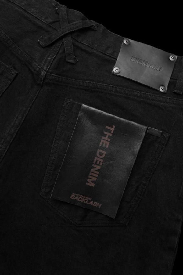 THE DENIM STRETCH SELVEDGE DENIM LOOSE FLARE PANTS “ONEWASH.BLACK”